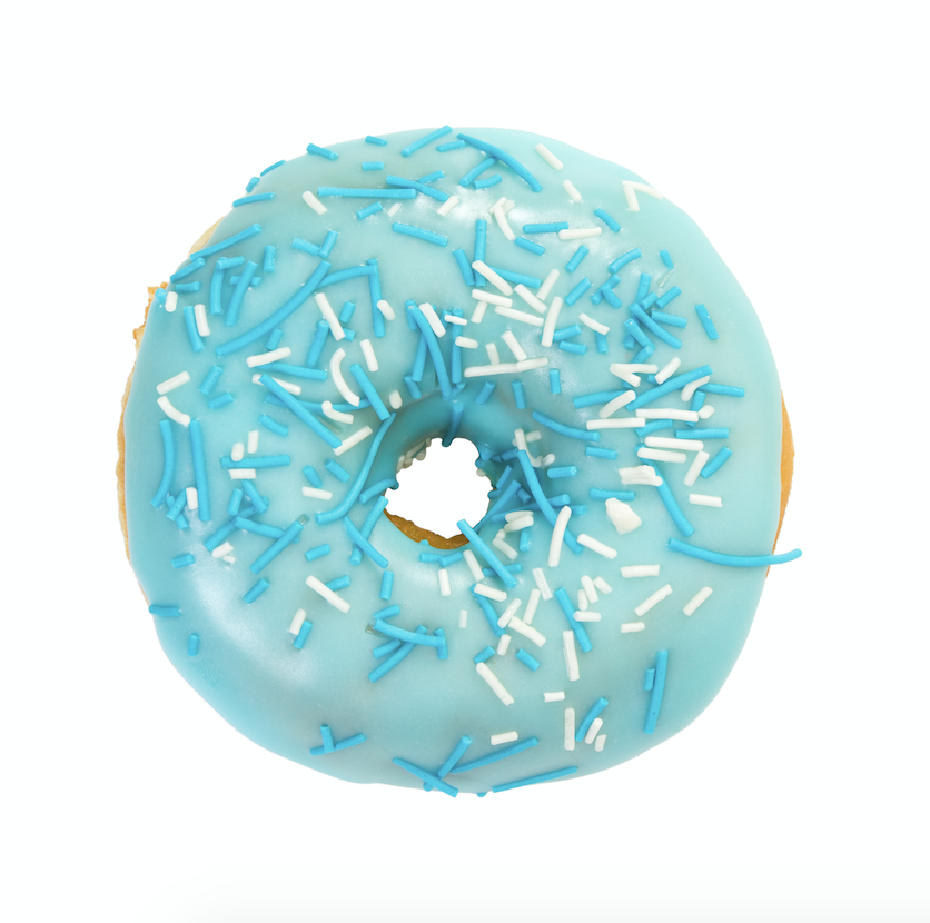 A delicious donut topped with vibrant light blue frosting, colored with BioconColors natural blue colorant derived from Spirulina or Huito.